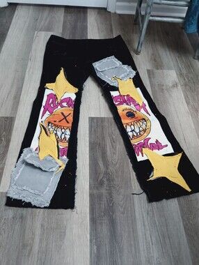 Black Rockstar Flare Graphic Distressed Patchwork Pants with Yellow Star Accents